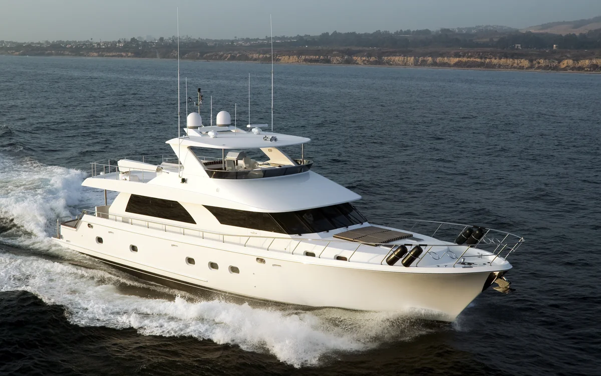Motor yacht underway along the coast